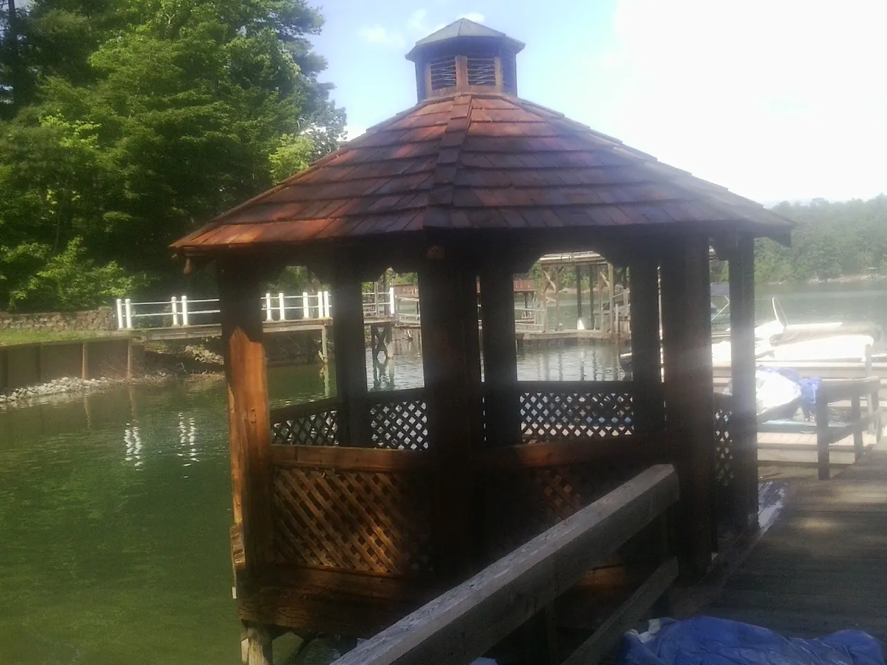 Cedar shake gazebo roof rebuilt on a lake dock in Petersburg